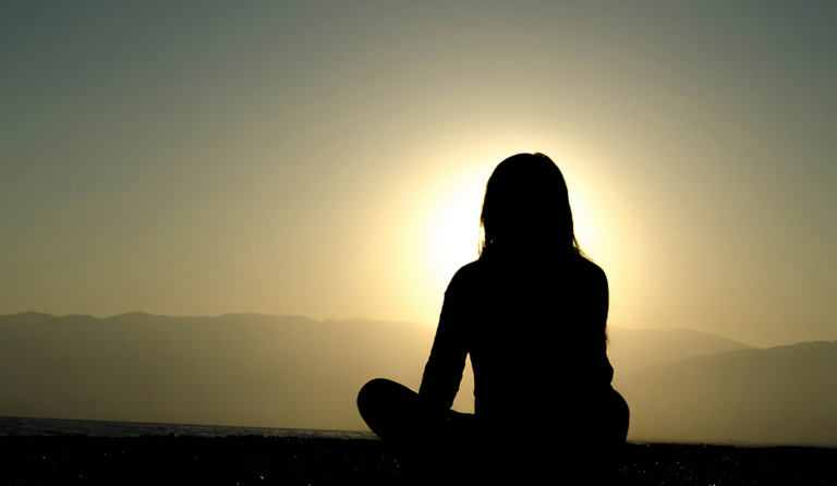Woman relaxing during a wellness reset routine