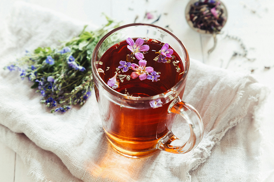 Warm herbal tea setup with calming wellness aesthetic and natural light
