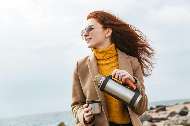 Woman practicing healthy daily habits outdoors to support wellness and balance naturally