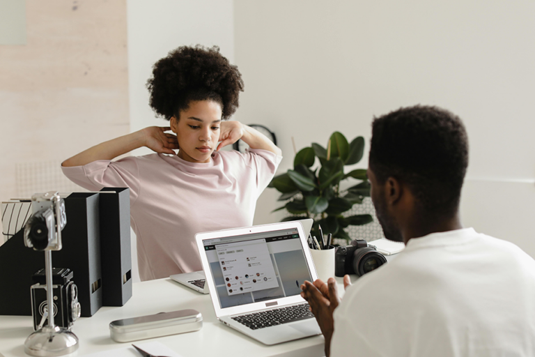 Woman stretching after sitting at a desk all day to relieve tension and improve posture
