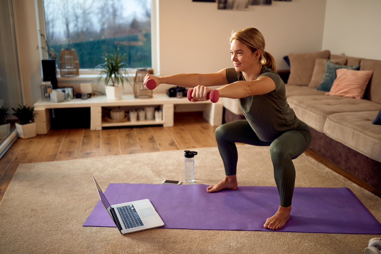 Woman performing a beginner strength training exercise at home