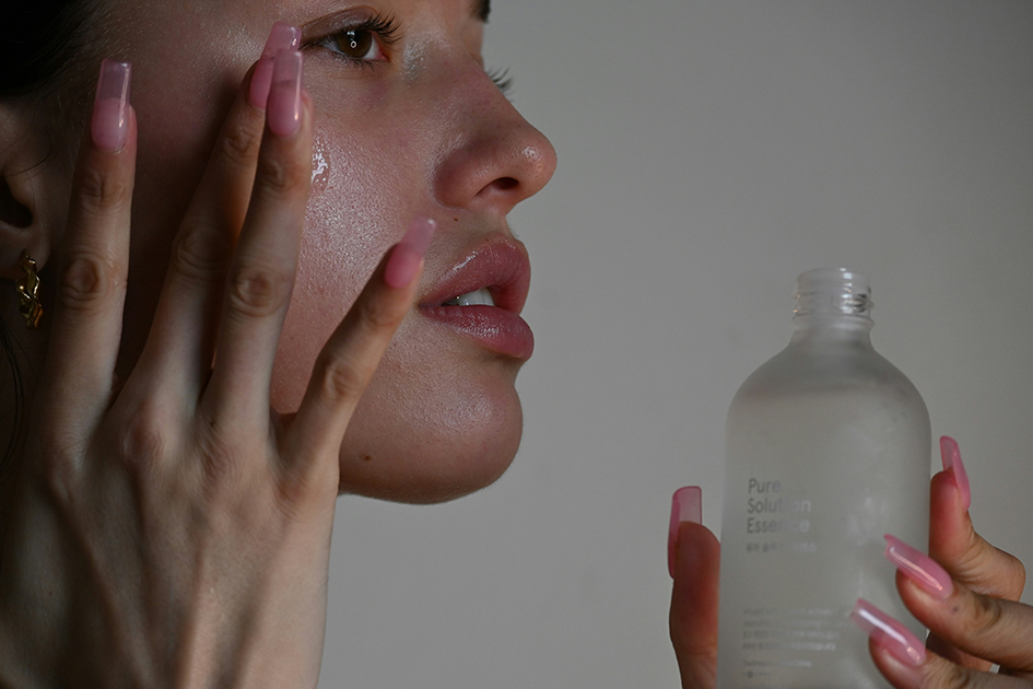 Woman applying skincare products during her morning skincare routine