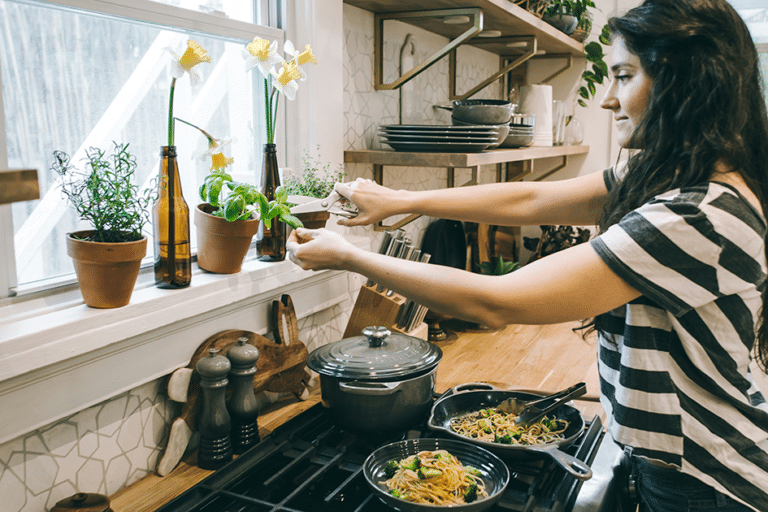 Woman in a healthy kitchen supporting digestion and gut health