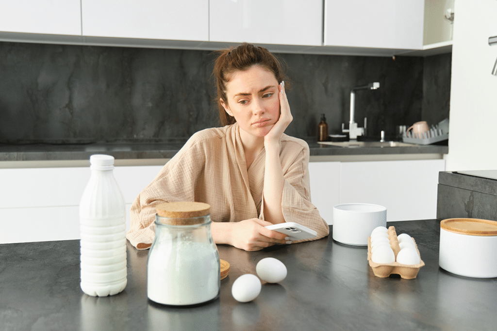Woman considering dairy foods after experiencing digestive discomfort