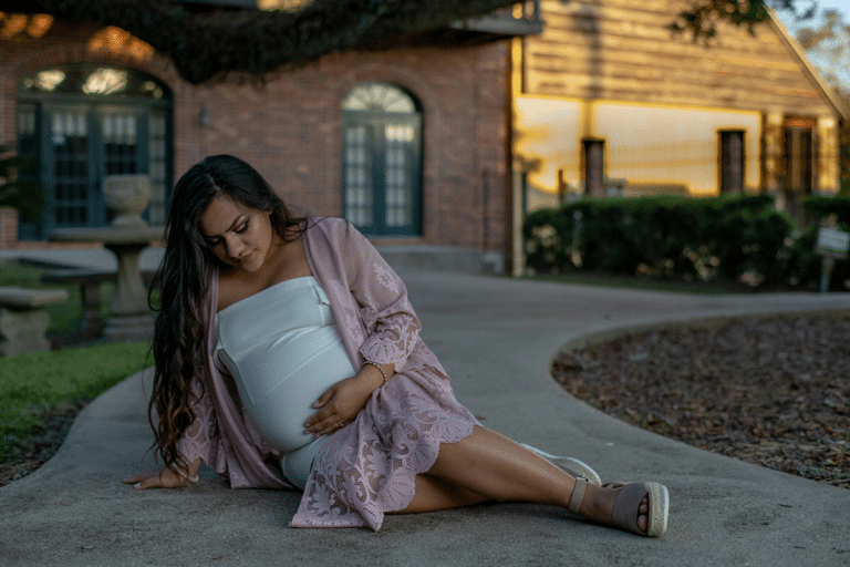 Pregnant woman holding her belly while experiencing contractions late in pregnancy