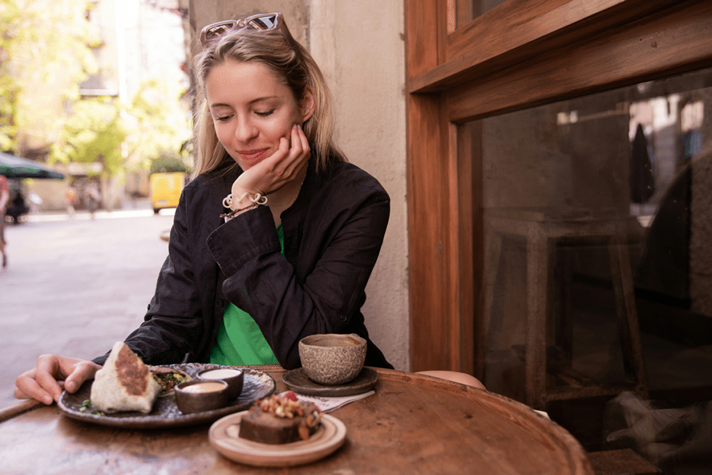 Woman feeling full after eating only a few bites