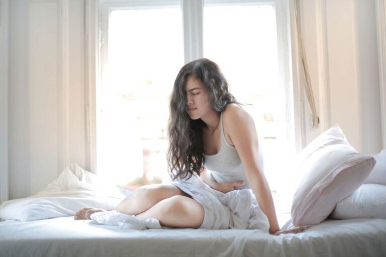 Woman feeling uncomfortable after an incomplete bowel movement