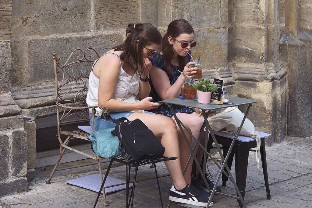 Women spending time together at an outdoor cafe