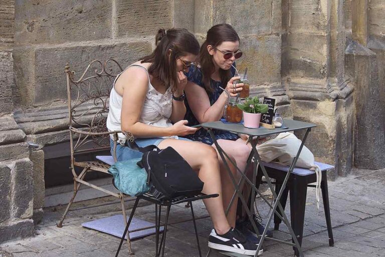 Women spending time together at an outdoor cafe